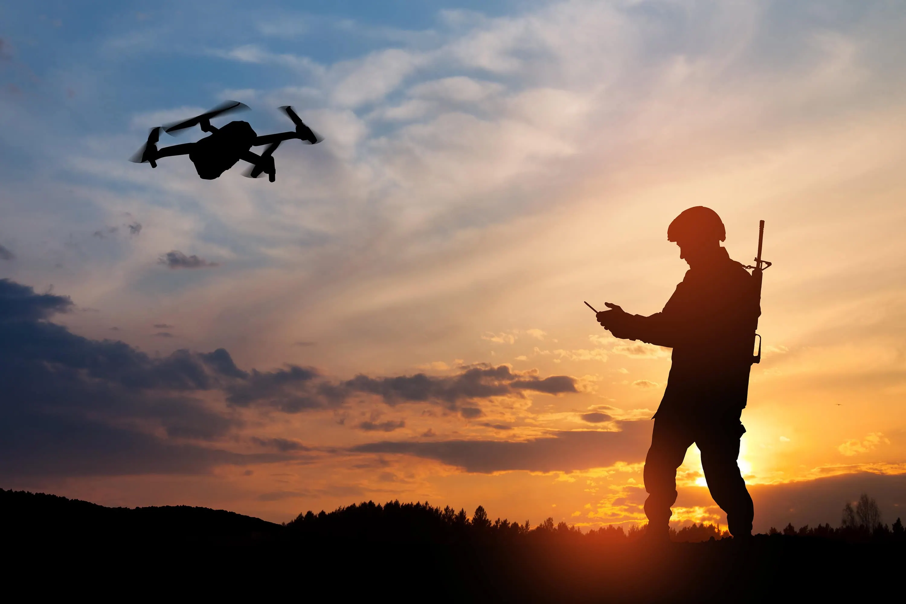 silhouette of soldier are using drone